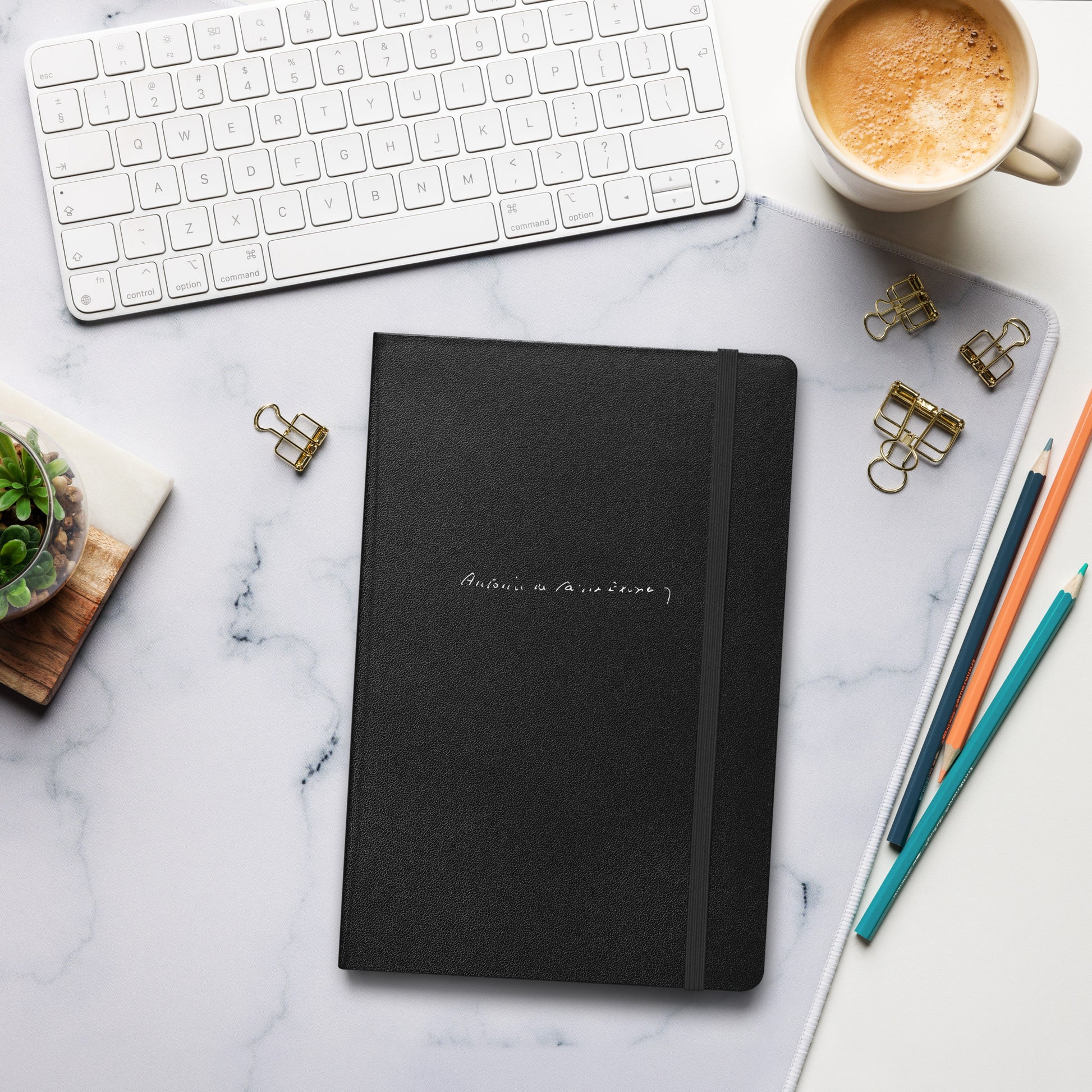Antoine de Saint-Exupery signature black notebook lifestyle