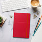 Antoine de Saint-Exupery signature red notebook lifestyle