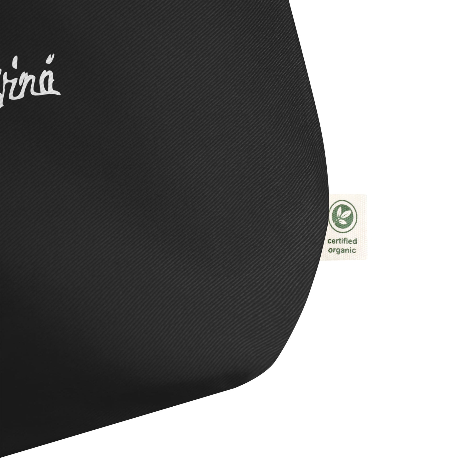 Leonardo da Vinci signature organic black shopper bag tag detail
