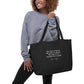 Virginia Woolf quote shopper bag 'No need to hurry. No need to sparkle.', black model